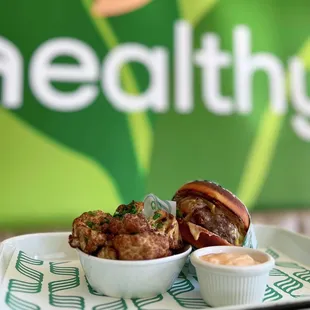 Keto Burger: Grilled beef patty, cheddar, caramelized onion, grilled mushroom, homemade keto bun w/ fried cauliflower, chipotle aioli | $18