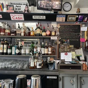 a bar counter with liquor bottles