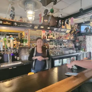 Bartender behind the bar