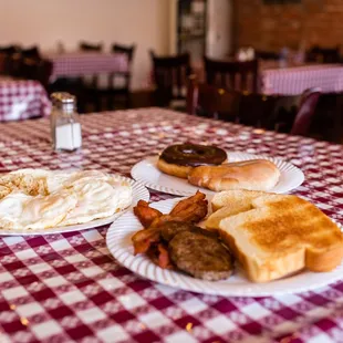 two plates of breakfast food on a table