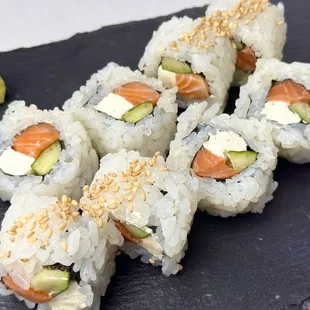 【Smoke Salmon Philly Roll】Savor the richness of our Smoke Salmon Philly Roll. Creamy cheese, savory smoked salmon, and fresh vegetables comb