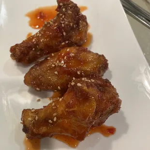 Spicy Wing, you get 4 but I already ate one. Crispy and sauced up, good wings