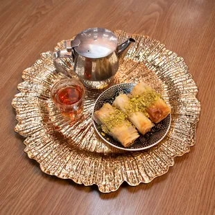 a plate of pastries and a cup of tea