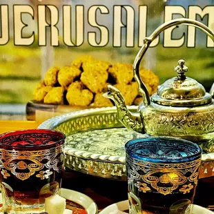 a teapot and two glasses