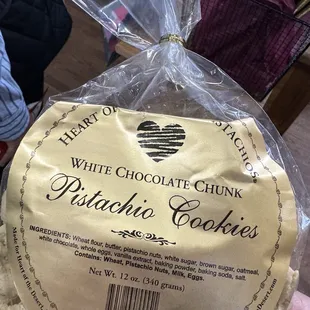 a bag of white chocolate chunk pistachio cookies