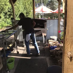 Wood fire pizza made outside. They looked delicious.