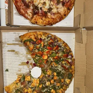 small meat lovers (left), medium half chicken/half paneer tikka pizza