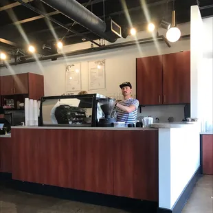 a bari serving a cup of coffee