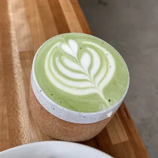 a cup of matcha and a piece of cake