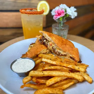 a plate of french fries and a sandwich