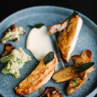 a plate of food on a black table