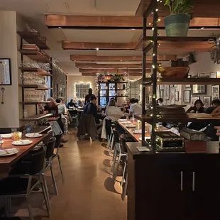 people sitting at tables in a restaurant