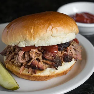 Our house specialty pulled pork sandwich is smoked right here!