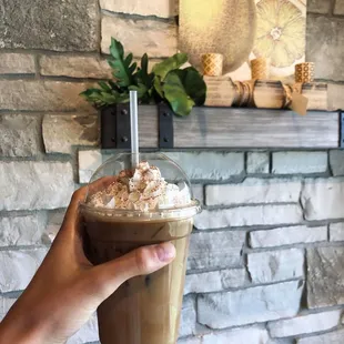 The iced Chai latte with whipped cream