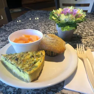 The Quiche Plate is a favorite for brunch, with a dish of fresh cut fruit and a fluffy muffin