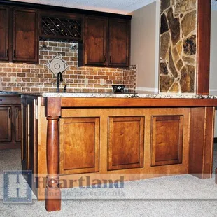 a kitchen with a brick wall