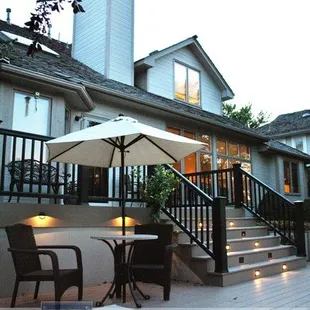 a patio with a table and chairs