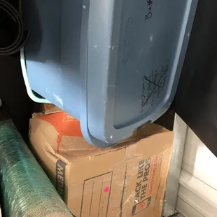 Totes smashed because 100 pound tile placed on top of stack.