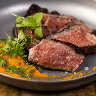 Flame-grilled meat made in the heart of our dining room.
