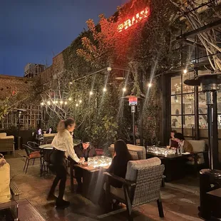 The front. Outdoor heated seating area. Very cozy.