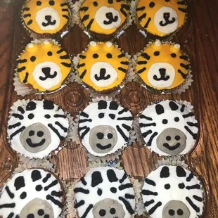 Lions, tigers, and bears oh my, well just tigers and zebra cupcakes