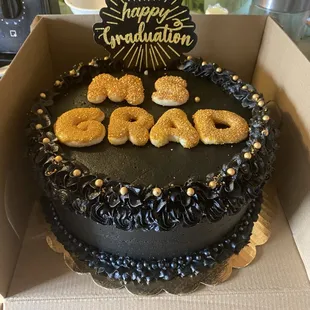 Strawberry flavored cake with dark chocolate frosting