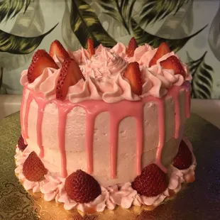 Lemon Soak cake with fresh strawberries in between layers of strawberry buttercream