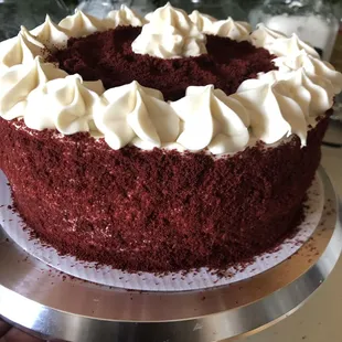 Red Velvet with cream cheese frosting coated in red velvet cake crumbs