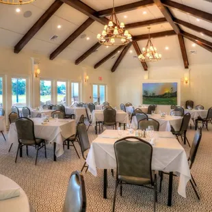 a dining room with tables and chairs