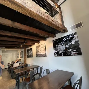 a woman standing in a coffee shop