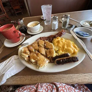 pancakes cheese eggs sausage and bacon and cheese grits which tasted ok but I wouldn&apos;t order again. I love diner coffee.