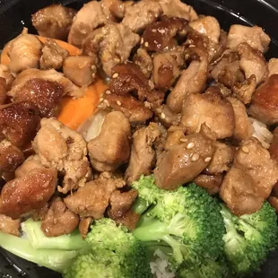 Chicken Teriyaki: New crop-esque rice, crisp broccoli, chopped dark meat, Soy sauce. Not sweet/sticky American. Simple complete meal.