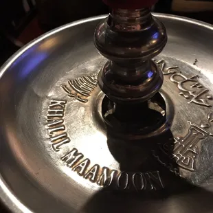 a close up of a metal hookah