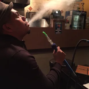 a man smoking a hookah