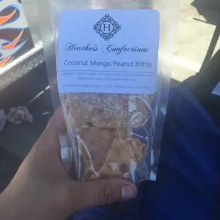 a bag of coconut mango brittle