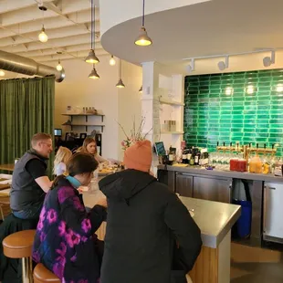 a group of people sitting at a bar