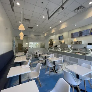 Another angle of their indie seating area with display cases of their ice cream and desserts.  Love the &quot;heavenly&quot; design on their floor.