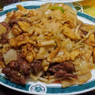 a plate of chinese food on a table