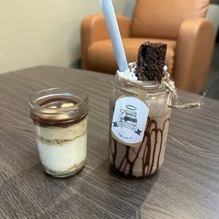 The Brownie Ice-Cream Shake is delicious! On the left hand it&apos;s the 8oz Snicker Cheesecake!