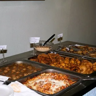 a buffet of food on a buffet table