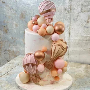 a cake decorated with balloons