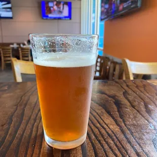 a glass of beer on a table