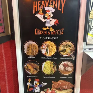 The door display with menu items and contact info.