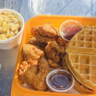 4 whole fried chicken wings, a golden brown Belgian malted waffle served with a side of heavenly potatoes and warm syrup