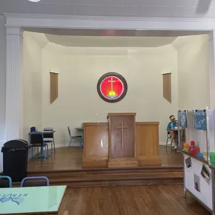 an empty church with wooden floors