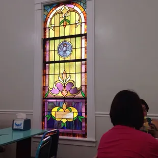 Beautiful stained glass windows. Everything is bright.