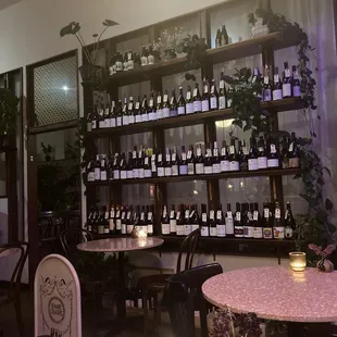 bottles of wine on shelves in a restaurant