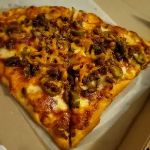 a slice of pizza in a box