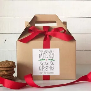 a box of cookies with a red ribbon