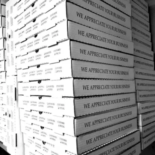 a stack of pizza boxes